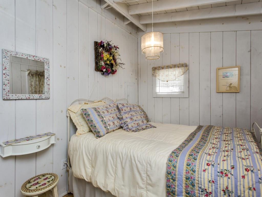 91 Samoset Trail East Boothbay, ME 04544 - Photo 11 of 29 A bedroom with closet and wood floor.
