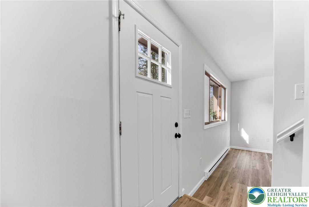 4127 Indian Avenue Pocono Summit, PA 18346 - Photo 14 of 41 a view of a hallway with windows and hardwood floor