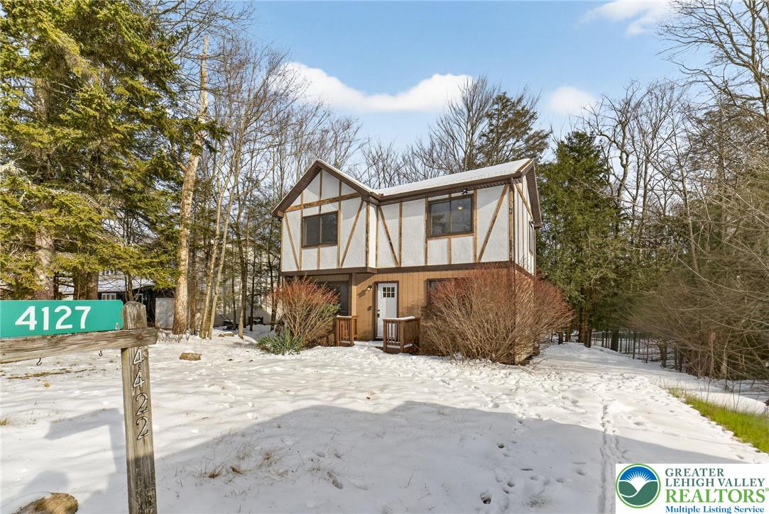 4127 Indian Avenue Pocono Summit, PA 18346 - Photo 2 of 41 a front view of a house with a yard