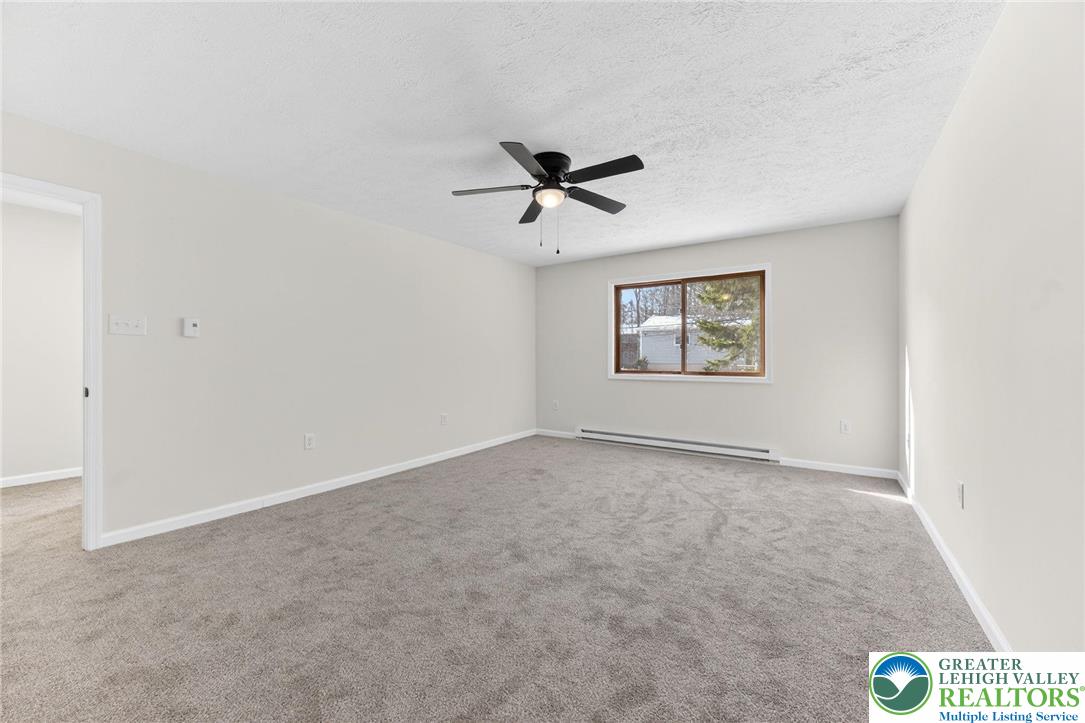 4127 Indian Avenue Pocono Summit, PA 18346 - Photo 22 of 41 an empty room with fan and windows