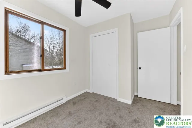 a view of room with ceiling fan
