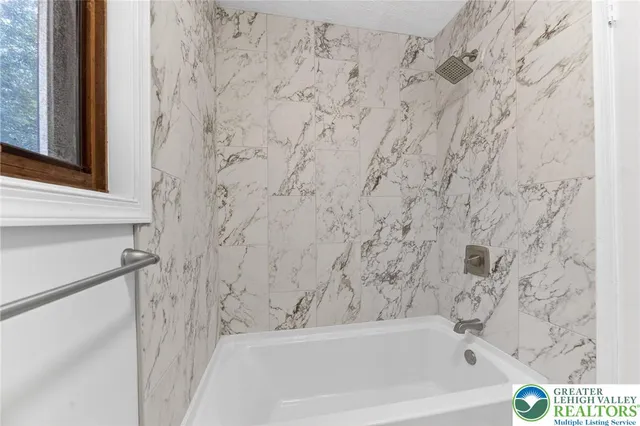 a side view of a house with a yard