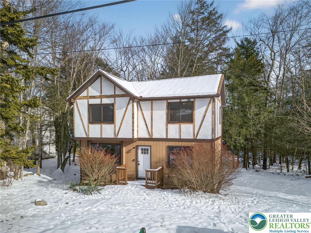 4127 Indian Avenue Pocono Summit, PA 18346 - Photo 37 of 41 a front view of a house with garden