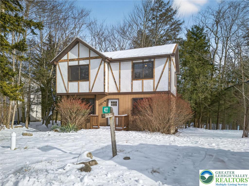 4127 Indian Avenue Pocono Summit, PA 18346 - Photo 38 of 41 a front view of a house with a yard