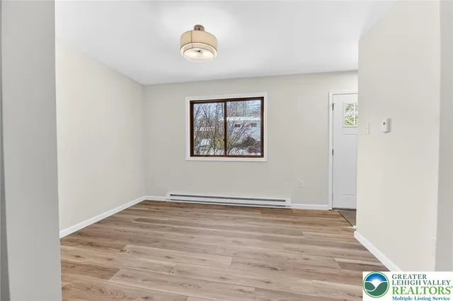 a view of hallway with wooden floor