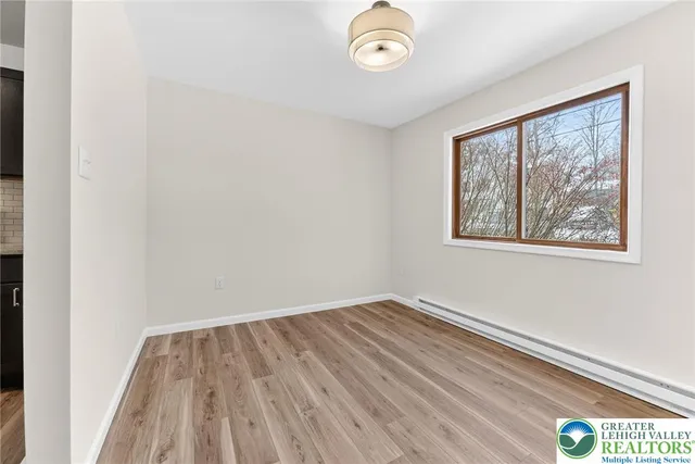 a kitchen with a refrigerator stove and microwave