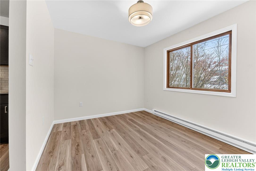 4127 Indian Avenue Pocono Summit, PA 18346 - Photo 10 of 41 a view of room with window and hardwood floor