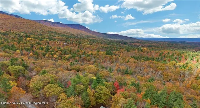 a view of mountain with an ocean
