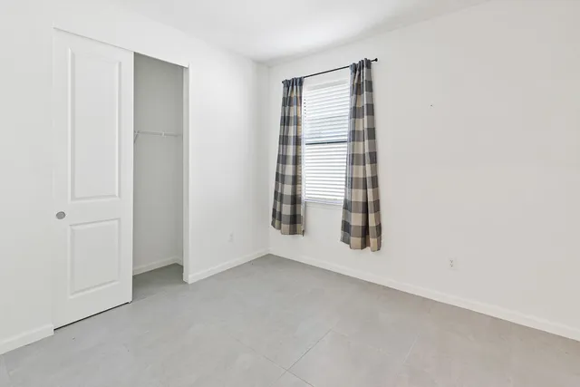 a view of a backyard with sitting area