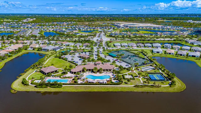 a view of a balcony with floor to ceiling windows with wooden floor