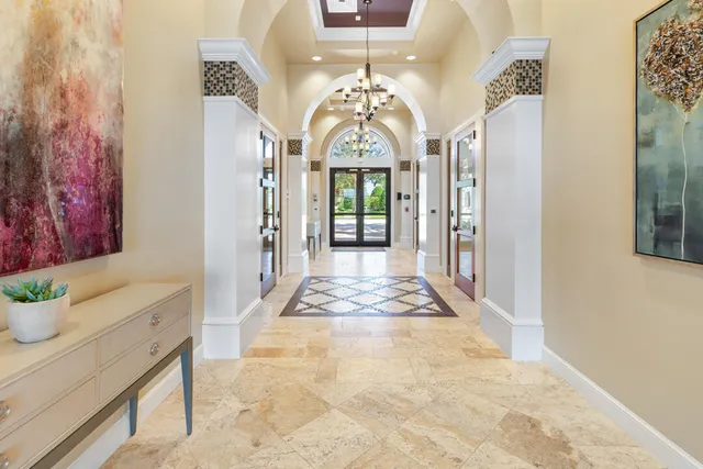 a room with pool table and windows