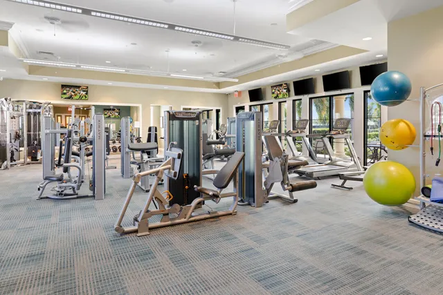 a dining room with furniture and a floor to ceiling window