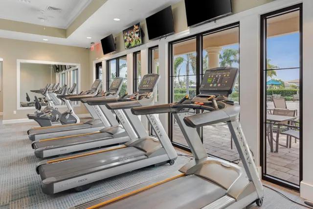 a view of a patio with table and chairs and potted plants