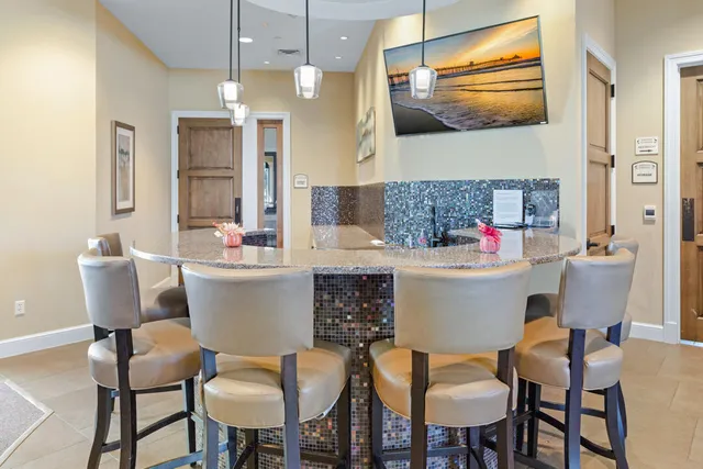 a view of a bench in the backyard of a house