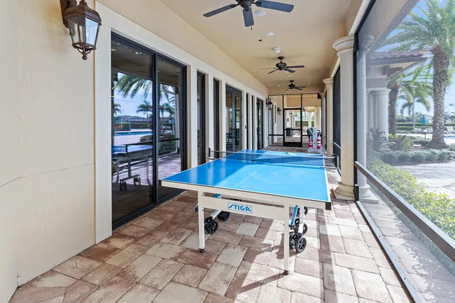 a view of a swimming pool with an outdoor seating