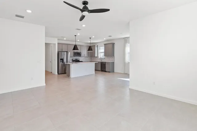 a view of an empty room with a balcony