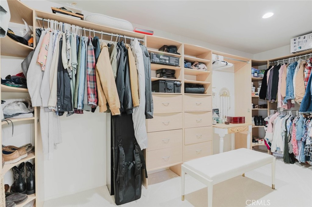 32480 The Old Road Castaic, CA 91384 - Photo 49 of 68 a view of walk in closet with clothes and shoes