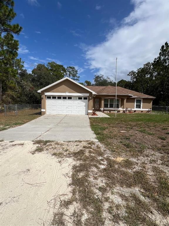 16016 Mulhatton Road Weeki Wachee, FL 34614 - Photo 1 of 14 a view of a house with a yard