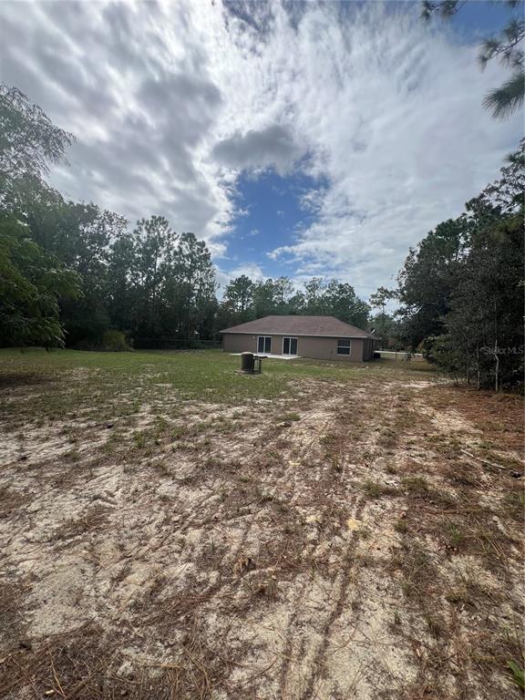 16016 Mulhatton Road Weeki Wachee, FL 34614 - Photo 14 of 14 a view of a lake with houses in the back