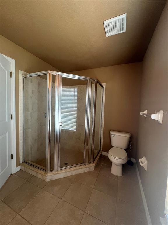 16016 Mulhatton Road Weeki Wachee, FL 34614 - Photo 8 of 14 a bathroom with a toilet and a shower