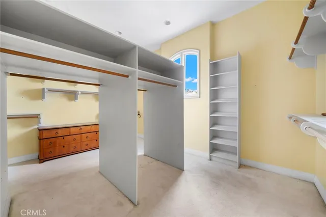 a large bathroom with a double vanity sink a large mirror and a bathtub