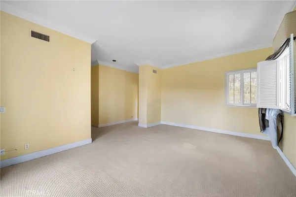 a bathroom with a granite countertop sink mirror and toilet