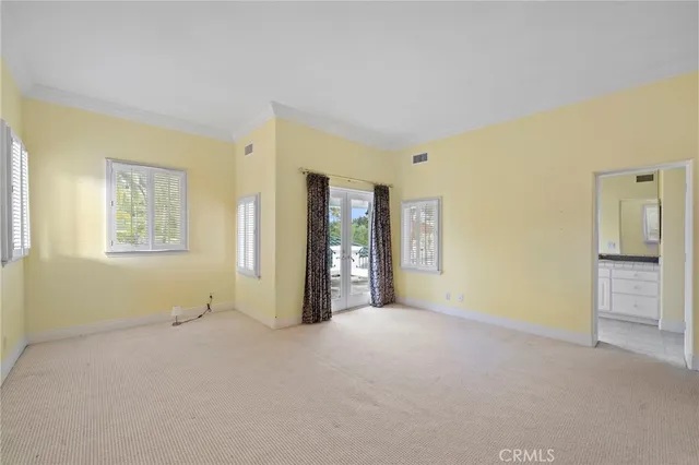 a kitchen with a stove a sink a dining table and chairs