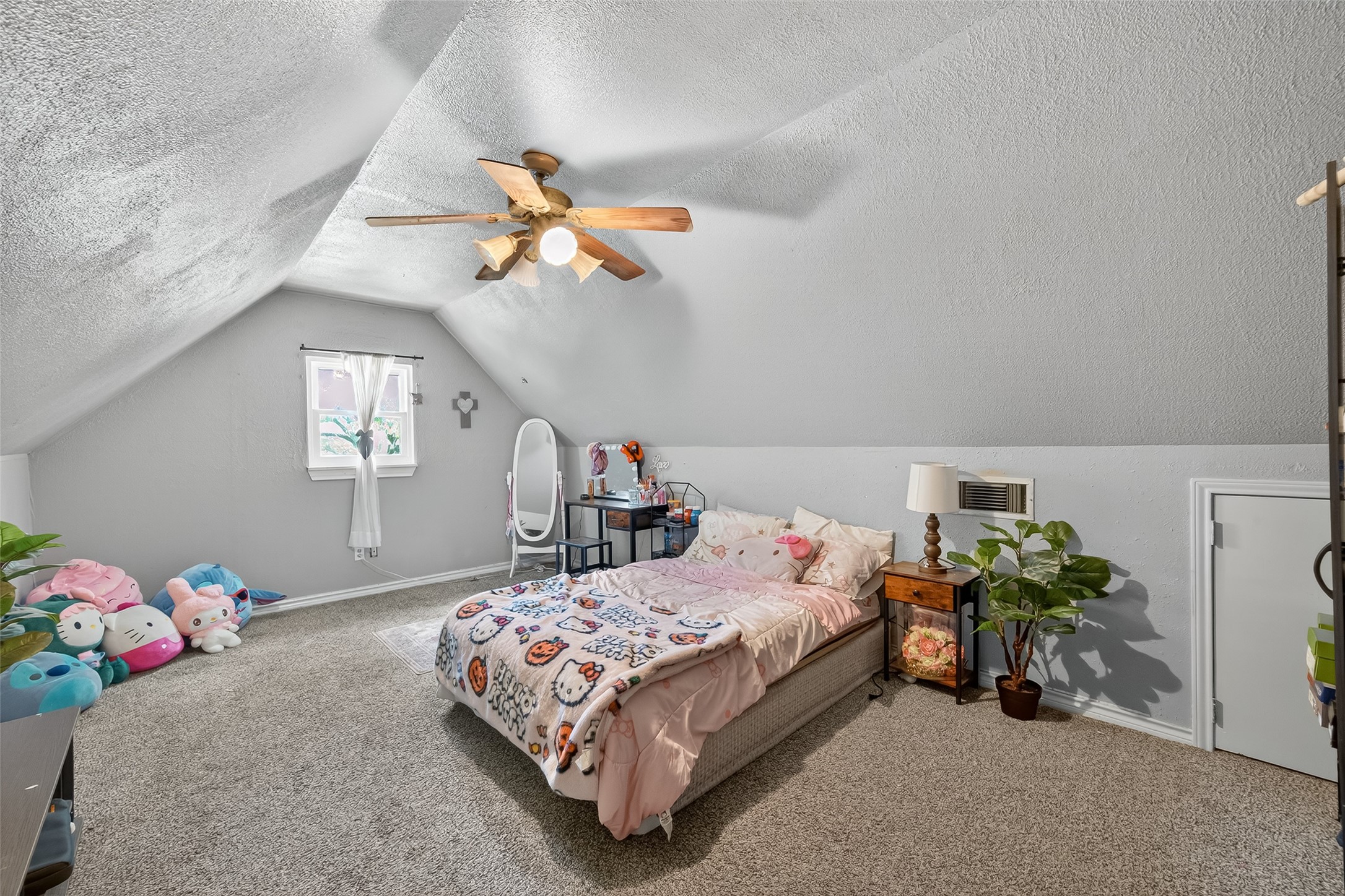 2103 Diane Street Pinehurst, TX 77362 - Photo 13 of 17 a bedroom with a bed and a chandelier