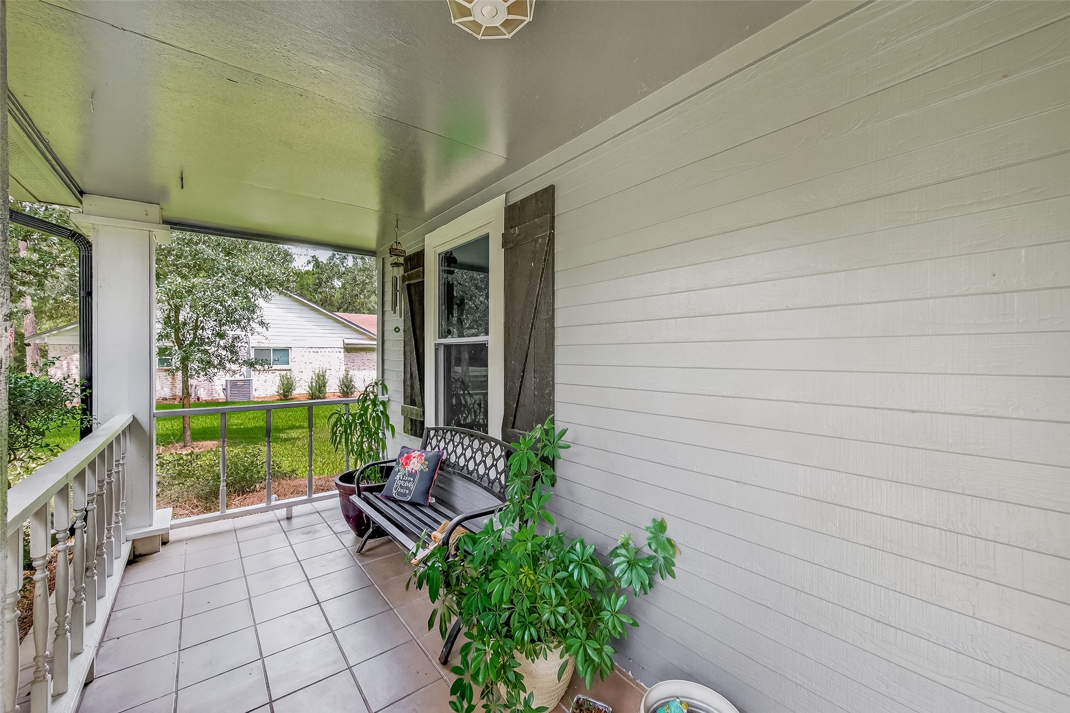 2103 Diane Street Pinehurst, TX 77362 - Photo 2 of 17 a garden view with a seating space