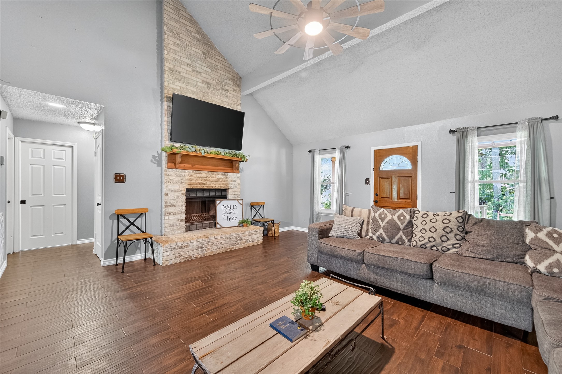 2103 Diane Street Pinehurst, TX 77362 - Photo 3 of 17 a living room with furniture fireplace and flat screen tv