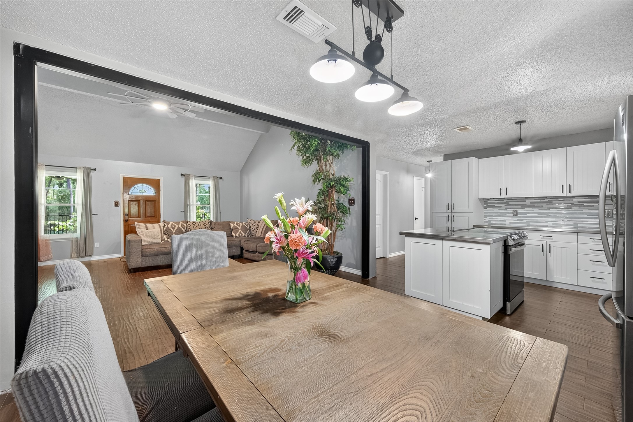 2103 Diane Street Pinehurst, TX 77362 - Photo 5 of 17 a view of a kitchen and dining room