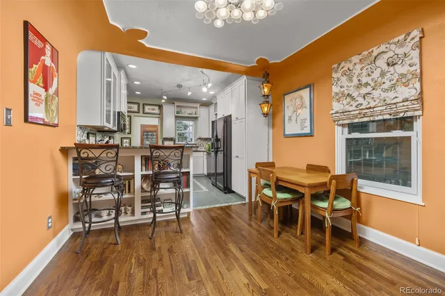 a kitchen with kitchen island stainless steel appliances a sink stove and refrigerator