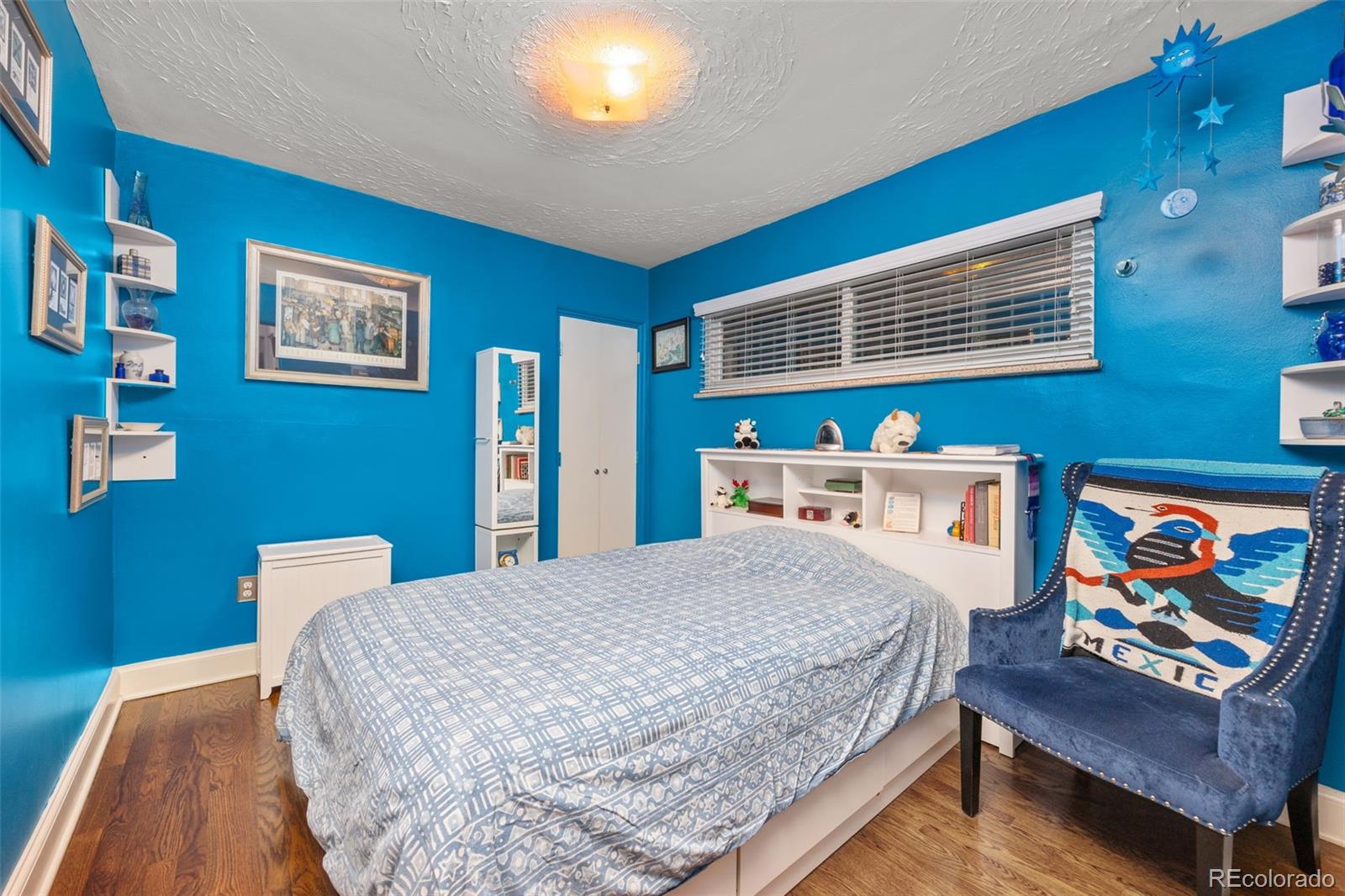 2514 Humboldt Street Denver, CO 80205 - Photo 16 of 39 a bedroom with a bed and a couch