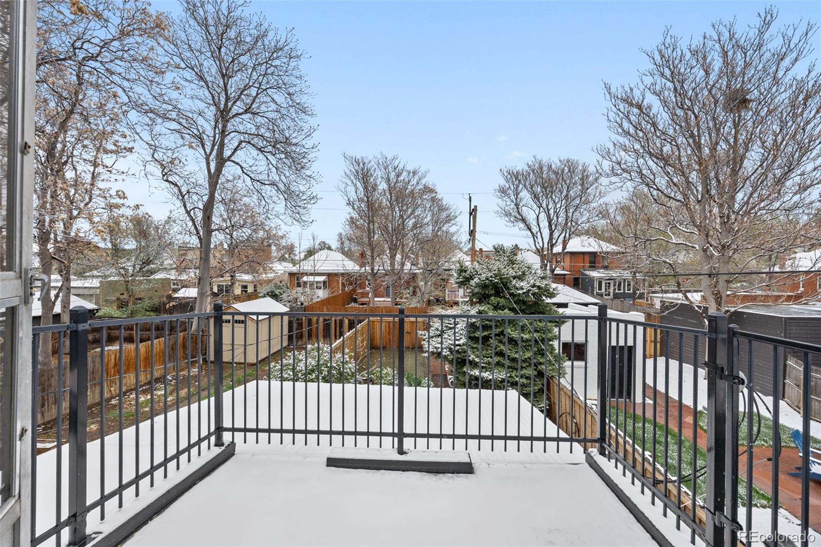 2514 Humboldt Street Denver, CO 80205 - Photo 31 of 39 a view of a houses with a small yard and wooden fence