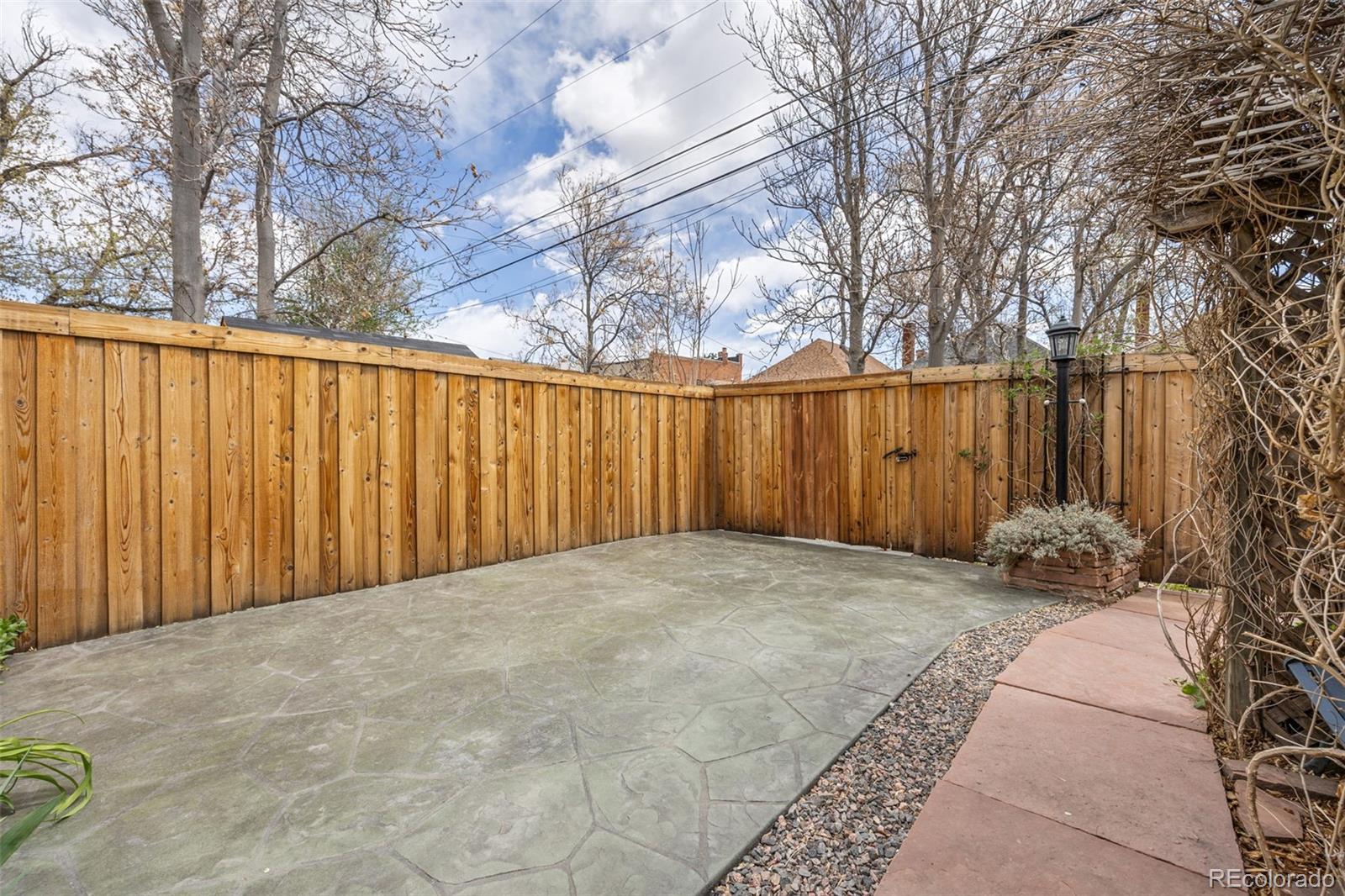 2514 Humboldt Street Denver, CO 80205 - Photo 37 of 39 a view of backyard with wooden fence