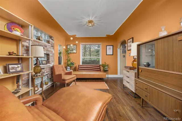 a workspace with wooden floor and windows