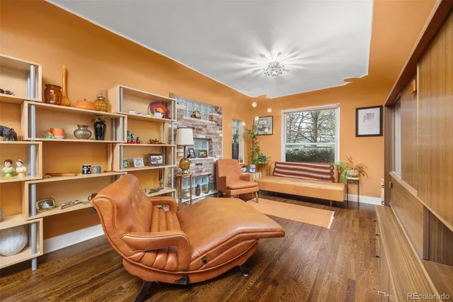 a room with wooden floor and furniture