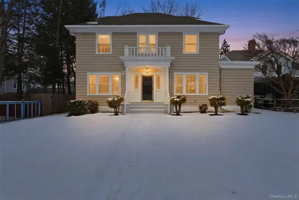 a view of a building with cars park