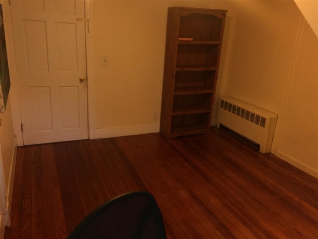139 South Street, Unit 3 Waltham, MA 02453 - Photo 3 of 3 an empty room with wooden floor