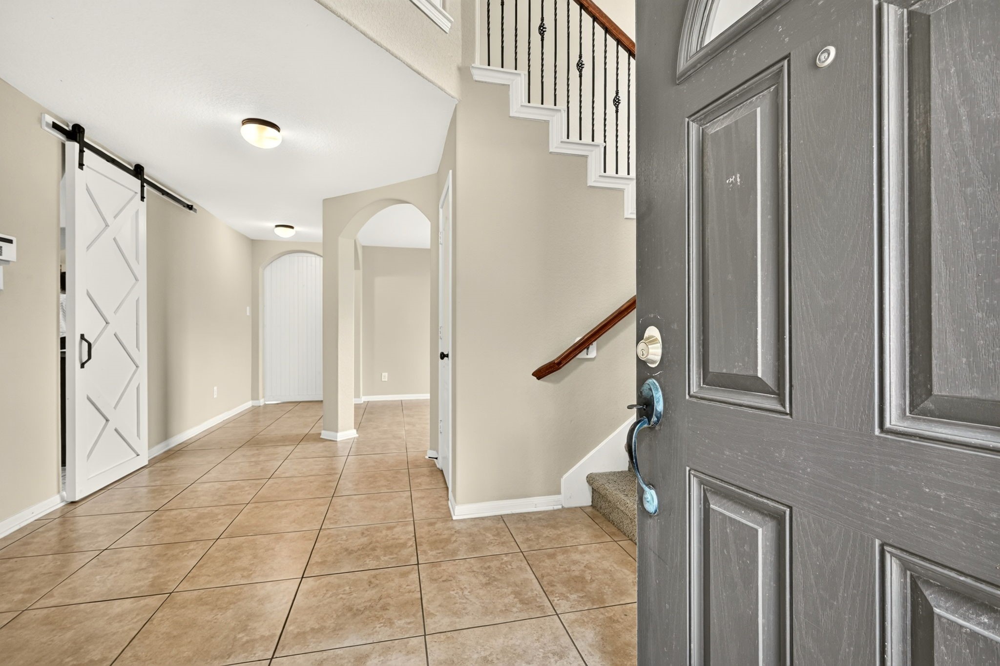 6446 Tea Tree Drive Katy, TX 77494 - Photo 8 of 39 Come inside and check it out. This double height entry gives a spacious welcome.
