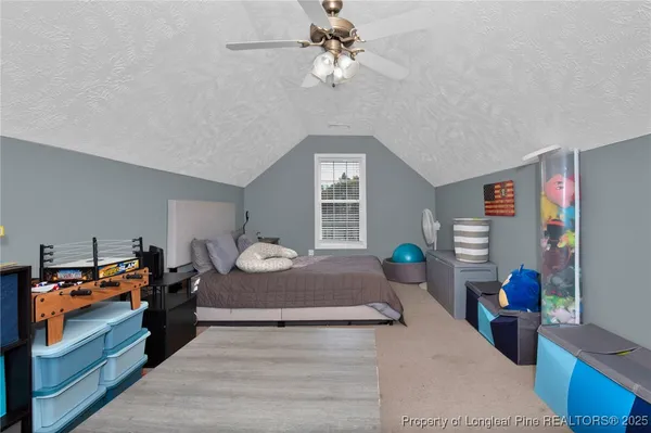 a bedroom with bed and window