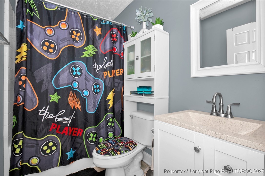 674 Copper Creek Drive Raeford, NC 28376 - Photo 15 of 20 a bathroom with a sink and a mirror