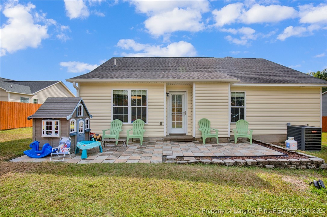 674 Copper Creek Drive Raeford, NC 28376 - Photo 17 of 20 a front view of house with swimming pool and green space