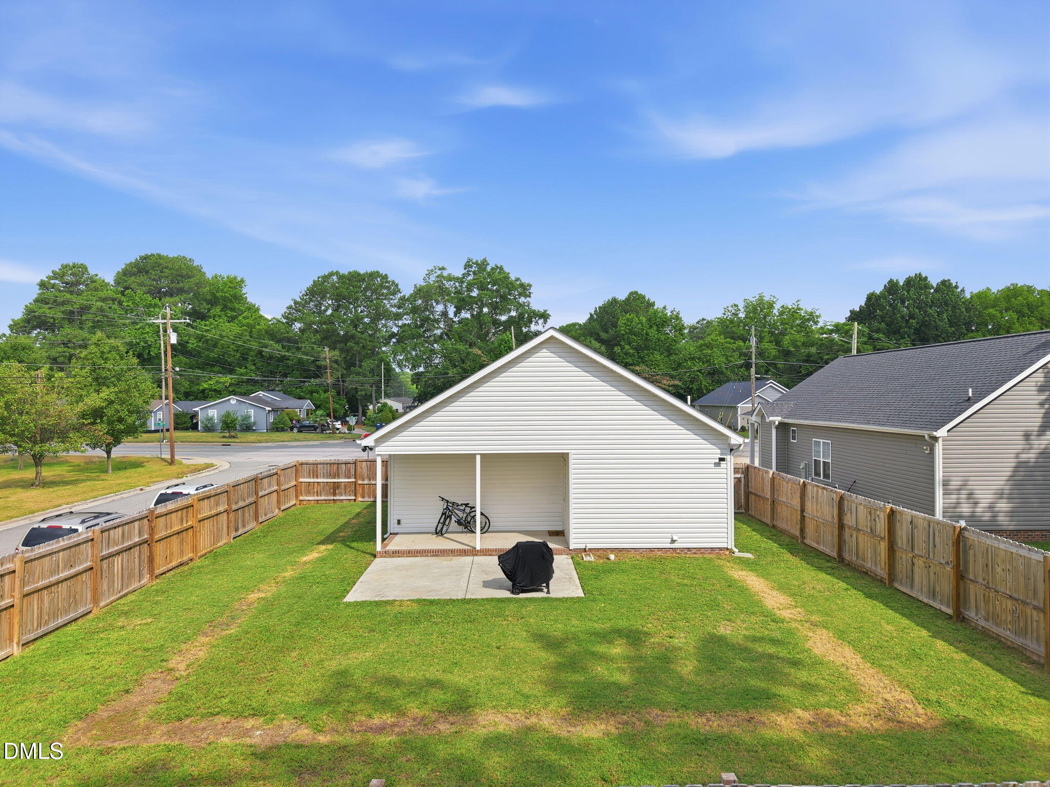 709 South Pollock Street Selma, NC 27576 - Photo 27 of 30 a view of a house with a yard and sitting area