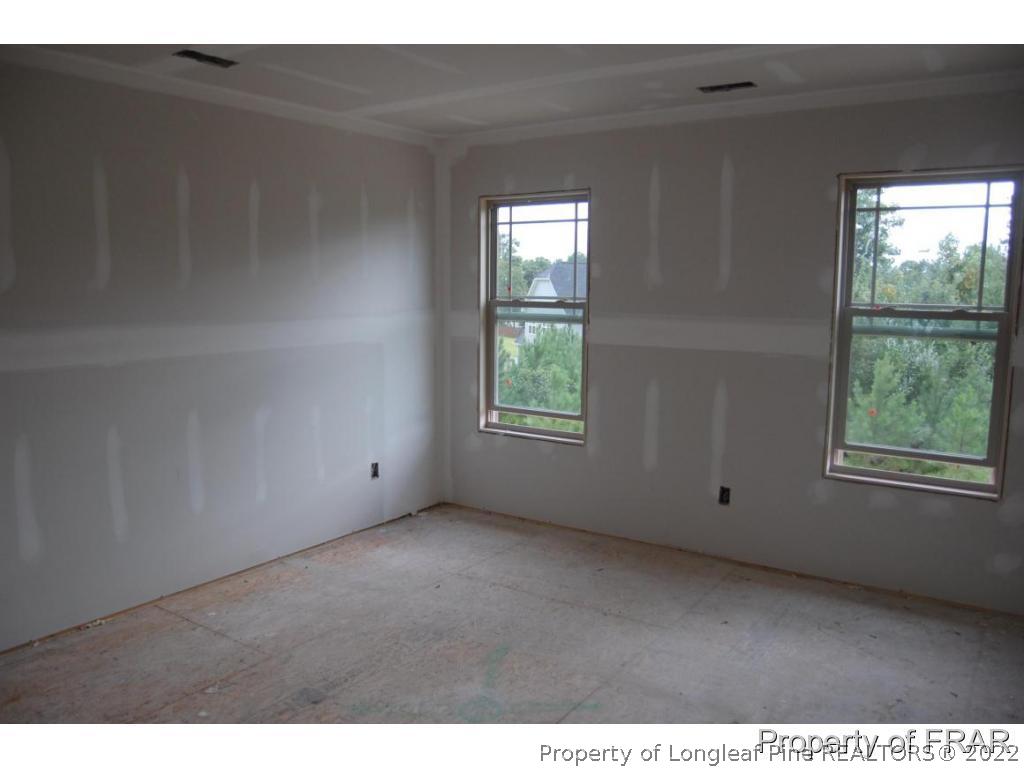 11 Rockingham Street Spring Lake, NC 28390 - Photo 9 of 14 a view of an empty room with a window
