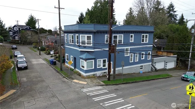 a front view of a house with a garden and pathway