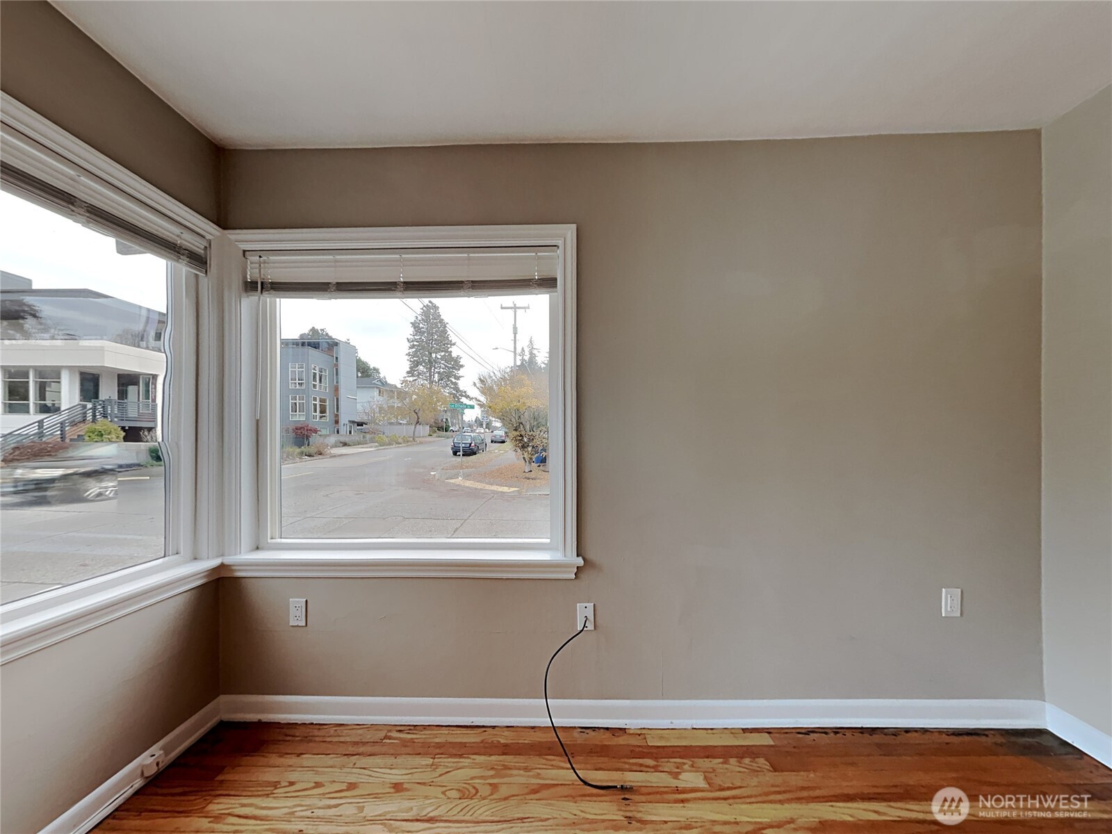 4700 Southwest Othello Street Seattle, WA 98136 - Photo 11 of 17 a view of empty room with wooden floor and fan