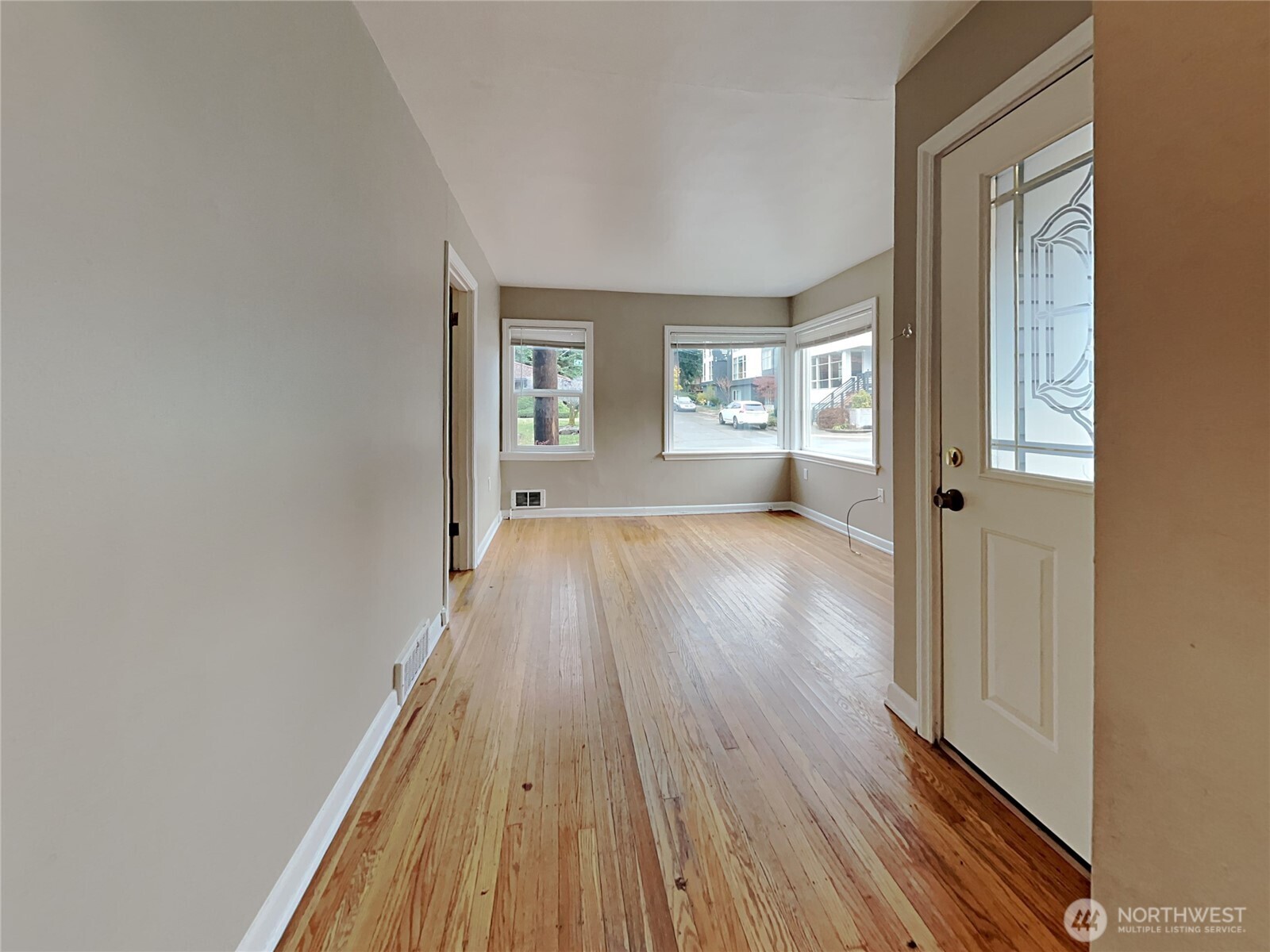 4700 Southwest Othello Street Seattle, WA 98136 - Photo 9 of 17 wooden floor in an empty room with a window