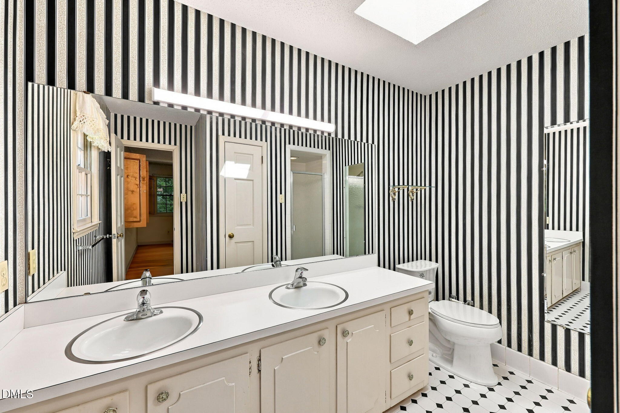 6102 Castlebrook Drive Raleigh, NC 27604 - Photo 39 of 63 Primary bath, Double Vanity. Take out the linen closet and expand the walk in shower.