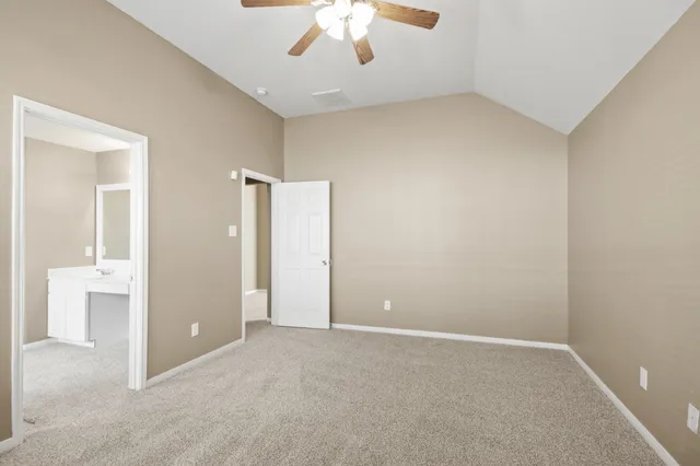 an empty room with a bathroom